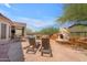 A gorgeous stone patio boasts a built-in fireplace, BBQ, lounge chairs, and access to the pool at 3060 N Ridgecrest -- # 200, Mesa, AZ 85207