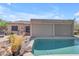 Sparkling pool with a rock feature and desert plants creates a tranquil backyard at 3060 N Ridgecrest -- # 200, Mesa, AZ 85207
