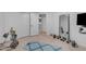 Functional workout room featuring weight racks, full length mirror, and open doorway at 3060 N Ridgecrest -- # 200, Mesa, AZ 85207