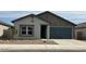 Charming single-story home featuring a two-car garage and low-maintenance desert landscaping at 36955 W Santa Maria St, Maricopa, AZ 85138