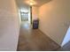 Attached garage space with utility equipment and white walls at 11546 E Kilarea Ave, Mesa, AZ 85209