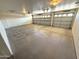 Spacious two car garage with two garage doors and white walls at 11546 E Kilarea Ave, Mesa, AZ 85209