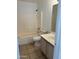 Standard bathroom featuring a shower-tub combo, toilet, and vanity with tile flooring at 11918 W Aster Dr, El Mirage, AZ 85335