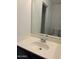 Bathroom vanity featuring a mirror and a sink at 11918 W Aster Dr, El Mirage, AZ 85335
