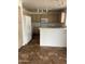 Kitchen featuring ample cabinet space and white appliances at 11918 W Aster Dr, El Mirage, AZ 85335