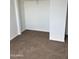 Spacious walk-in closet provides ample storage with carpeting and a shelf at 11918 W Aster Dr, El Mirage, AZ 85335