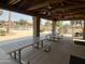Open-air pavilion offers shade with picnic tables, ceiling fans, and a view of the pool at 1502 W Wagner Dr, Gilbert, AZ 85233