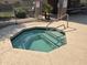 Inviting community spa featuring blue trim, steps, and jets surrounded by concrete at 1502 W Wagner Dr, Gilbert, AZ 85233