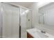Bathroom featuring a walk-in shower with chrome fixtures, a modern vanity, and a large mirror at 2620 W Piedmont Rd, Phoenix, AZ 85041