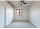 This bedroom features neutral carpet, natural light, and a ceiling fan at 2620 W Piedmont Rd, Phoenix, AZ 85041