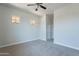 This bedroom features neutral carpet, natural light, and a walk-in closet at 2620 W Piedmont Rd, Phoenix, AZ 85041