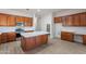 Beautiful kitchen with wood cabinets, stainless appliances, and a large marble island at 2620 W Piedmont Rd, Phoenix, AZ 85041