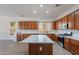 Spacious kitchen featuring wood cabinets, stainless steel appliances, and a sizable island at 2620 W Piedmont Rd, Phoenix, AZ 85041