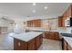 Bright kitchen featuring wood cabinets, stainless steel appliances, and a large island at 2620 W Piedmont Rd, Phoenix, AZ 85041