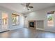Inviting living room with a cozy fireplace and lots of natural light at 2620 W Piedmont Rd, Phoenix, AZ 85041