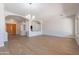 Bright and airy living room with hardwood floors, elegant columns, and ample natural light at 2620 W Piedmont Rd, Phoenix, AZ 85041