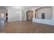 Spacious living room with hardwood floors, neutral walls and arched architectural details at 2620 W Piedmont Rd, Phoenix, AZ 85041