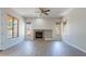 Bright living room featuring a fireplace, and many windows, providing ample natural light at 2620 W Piedmont Rd, Phoenix, AZ 85041