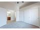 Spacious main bedroom with neutral carpet, white walls, and access to the ensuite bathroom and walk-in closet at 2620 W Piedmont Rd, Phoenix, AZ 85041