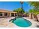 Beautiful in-ground pool with flagstone decking and mature landscaping provides a serene backyard oasis at 2620 W Piedmont Rd, Phoenix, AZ 85041