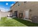 Well-maintained backyard with artificial grass is perfect for outdoor activities at 2640 N Heritage St, Buckeye, AZ 85396