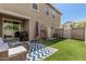 Spacious backyard with turf and patio offers a relaxing outdoor space at 2640 N Heritage St, Buckeye, AZ 85396