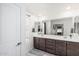 Bright bathroom featuring a double sink vanity with modern fixtures and neutral finishes at 2640 N Heritage St, Buckeye, AZ 85396
