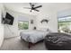 Bedroom featuring a bed, large bean bag, and windows providing natural light at 2640 N Heritage St, Buckeye, AZ 85396