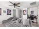 Comfortable living room/bedroom featuring a large cushioned sofa and entertainment setup at 2640 N Heritage St, Buckeye, AZ 85396