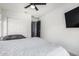 Bright bedroom with a ceiling fan, closet, and a view into the hallway at 2640 N Heritage St, Buckeye, AZ 85396