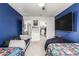 bedroom with colorful decor, large TV, and closet at 2640 N Heritage St, Buckeye, AZ 85396