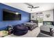' bedroom featuring twin beds, blue accent wall, and a cozy beanbag chair at 2640 N Heritage St, Buckeye, AZ 85396