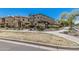Attractive exterior of a townhome with manicured desert landscaping and a welcoming walkway at 2640 N Heritage St, Buckeye, AZ 85396