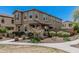 Charming townhome featuring desert landscaping, a covered porch, and well-maintained stucco at 2640 N Heritage St, Buckeye, AZ 85396
