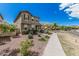 Lovely two-story townhome exterior featuring desert landscaping and a welcoming walkway at 2640 N Heritage St, Buckeye, AZ 85396