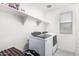 Bright laundry room features a modern washer/dryer and plenty of shelving at 2640 N Heritage St, Buckeye, AZ 85396