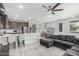 Open-concept living space featuring a kitchen, dining area, and comfortable living room with tile floors at 2640 N Heritage St, Buckeye, AZ 85396