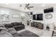 Comfortable living room featuring a large sectional couch and a ceiling fan at 2640 N Heritage St, Buckeye, AZ 85396