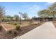 Community gathering area with cornhole, playground and seating at 4060 E French Trotter St, San Tan Valley, AZ 85140