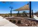 Community playground with shaded play equipment and landscaping at 4060 E French Trotter St, San Tan Valley, AZ 85140