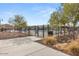 Community pool area with wrought iron safety fence and lounge chairs at 4060 E French Trotter St, San Tan Valley, AZ 85140