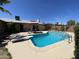 Stunning backyard pool with diving board, patio furniture and clear blue skies at 534 E Pebble Beach Dr, Tempe, AZ 85282