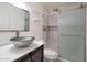 Bathroom featuring modern glass sink and a tiled walk-in shower at 600 S Dobson Rd # 67, Mesa, AZ 85202