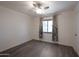 Bright bedroom featuring a ceiling fan and light colored flooring at 600 S Dobson Rd # 67, Mesa, AZ 85202
