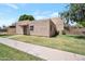 Charming single-story home showcasing a stucco exterior, small front yard, and tiled awning over the front door at 600 S Dobson Rd # 67, Mesa, AZ 85202