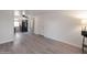 Inviting living area featuring gray laminate flooring, a modern ceiling fan, and views to the kitchen at 600 S Dobson Rd # 67, Mesa, AZ 85202