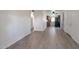 Open-concept living room with wood-look flooring leading to the kitchen area at 600 S Dobson Rd # 67, Mesa, AZ 85202