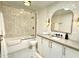 Contemporary bathroom with a shower over tub, modern sink, and stylish fixtures at 8332 E San Simon Dr, Scottsdale, AZ 85258