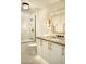 Modern bathroom featuring a shower over tub, single sink vanity, and neutral color palette at 8332 E San Simon Dr, Scottsdale, AZ 85258