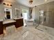 Luxurious bathroom with a freestanding tub, glass-enclosed shower, and elegant vanity at 8332 E San Simon Dr, Scottsdale, AZ 85258